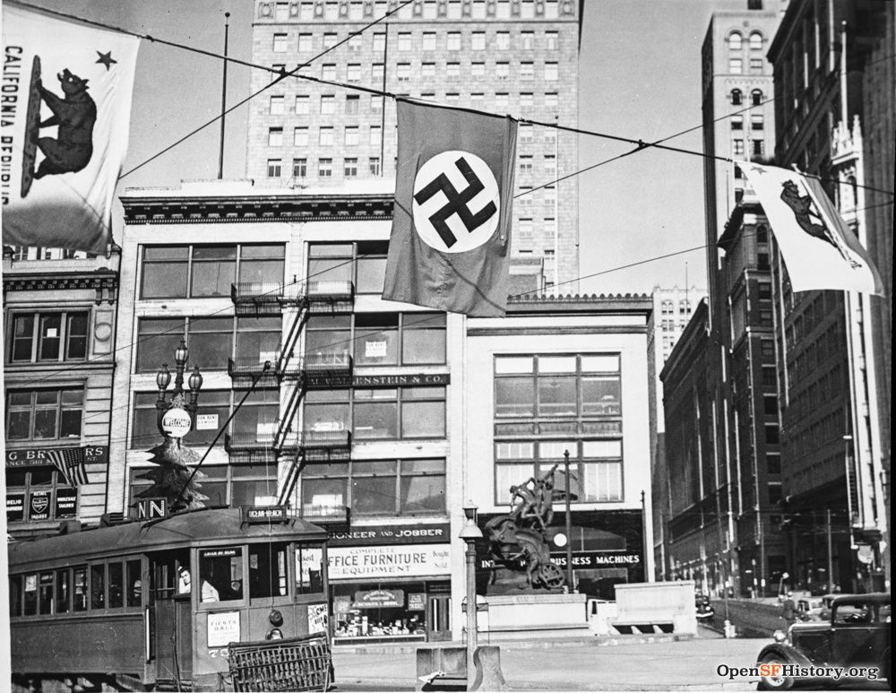 1937 view of street with Nazi flag.