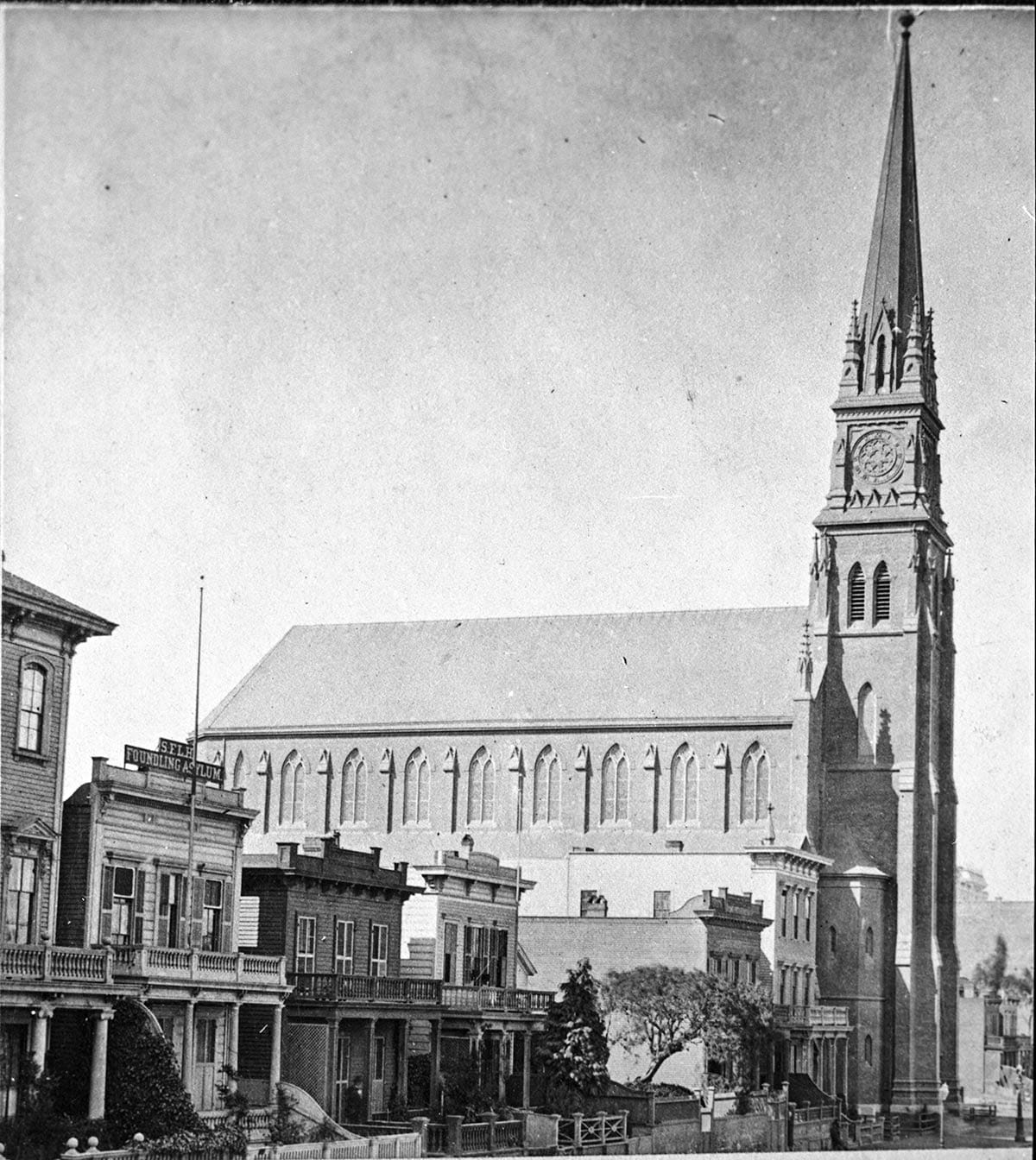 Street with houses and church in 1870s